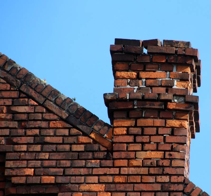 Signs Your Lincoln Park Home Needs a Chimney Inspection Damaged chimney on an Lincoln Park home showing cracks and missing mortar